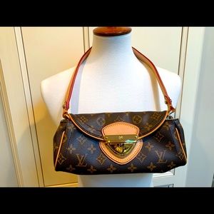 Brown and tan bag with gold hardware